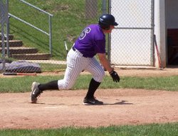 Second baseman Bruce Barnes breaks for first base after putting the ball in play.