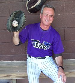 Don Gragnani holds up the ball from the final out in his 100th consecutive game caught last week.