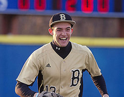 Scott Conyers celebrates with teammates Josiah at the end of the Rebels' March 28 victory over Danville. Conyers (Clay Jackson / April 28, 2013)
