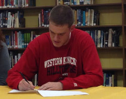 Micah Miniard signs a letter-of-intent Friday to play for Western Kentucky University during a ceremony at Boyle.