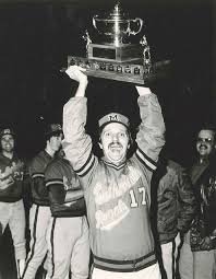 Saunders Hoists the NB Senior League Trophy