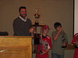 2011 PLAYER OF THE YEAR ROBBY LOIACONO RECEIVES THE INAUGURAL AWARD FROMREDS PRESIDENT JASON EVANS (12U MVP TYLER LOPEZ IN BACKGROUND)