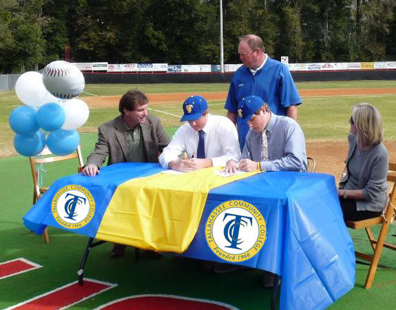 Proud parents, Tom & Maria Deckert, watch alongside TCC head coach Mike McLeod, as Ryan and Nick commit to play for TCC