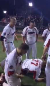 A big crowd celebrates with the Beavers after the final out