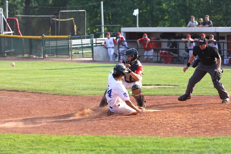 AJ Le slides home with the winning run in the World Series semifinal against the Chicago Clout.