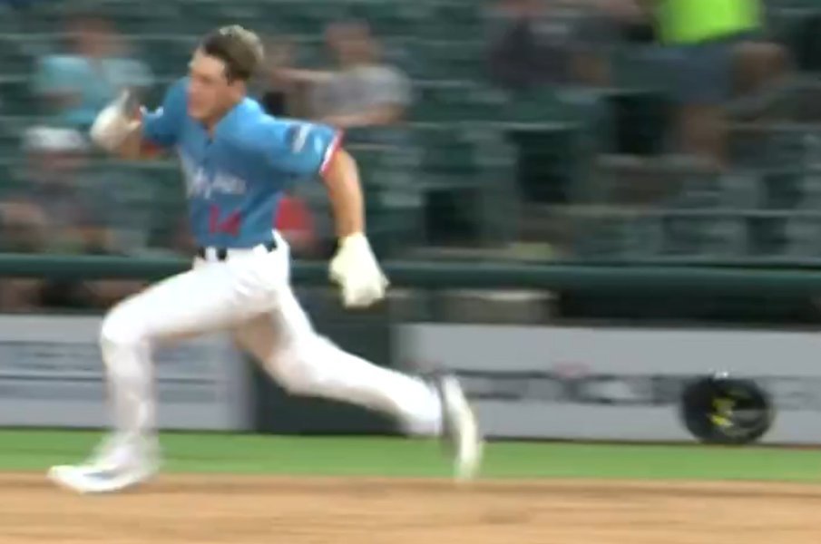 Lucas Spence outruns his helmet on the way to a triple for the Corpus Christi Hooks on Saturday.