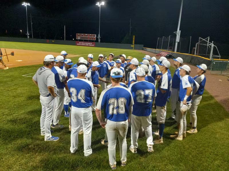 The Beecher Muskies huddle to discuss their 11-6 win over the New Jersey SoX in the NABF World Series at North Central College on Thursday, July 30, 2
