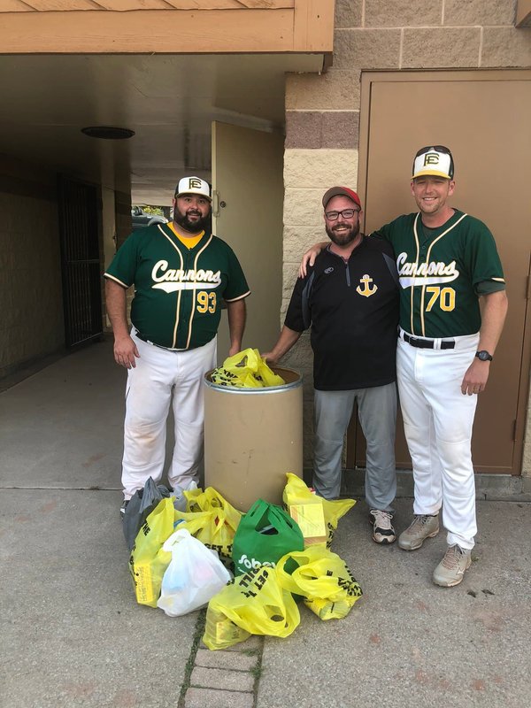 (left to right: Justin Hall, Aaron McInnis, Pat Giampaolo) Members of the Fort Erie Cannons and Thorold Anchors stand around a huge haul of goodies during the Anchors food rive last season.