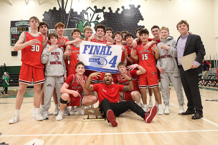 Celebrating with the Final Four trophy & banner