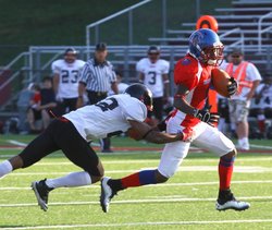 Southern Lakes Blue Devils receiver Markese McDowell attempts to elude an Elgin Eagles tackler in Saturday’s game at Westosha Central High School. The