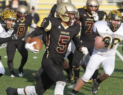 Douglass High School junior quarterback Devin Butler runs against South Carroll during Saturday’s game.  Bill Ryan/The Gazette