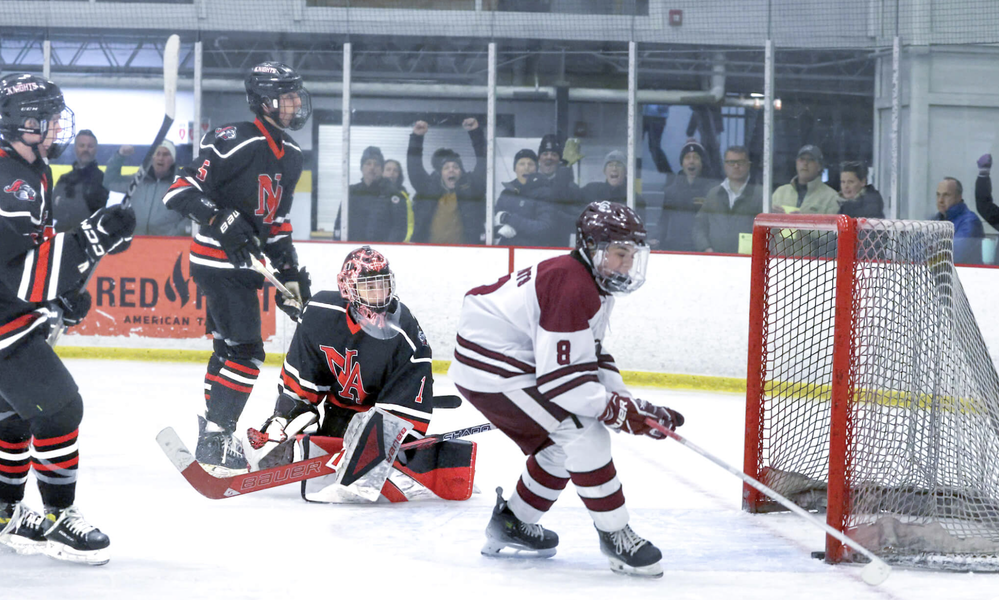 Declan Daley scores against North Andover. Photo b