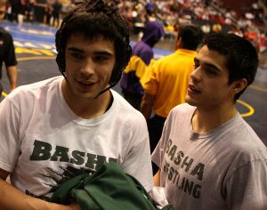 FAMILY PRIDE: Basha High School’s Ryan Jimenez, left, is congratulated by his twin brother, Tyler, after winning state in the 152-pound class. 