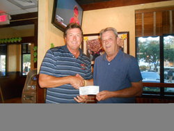 TMF PRESIDENT KEVIN MCLELLAN PRESENTING DONATION TO BRU'S BUDDIES BOB BRUDZINSKI