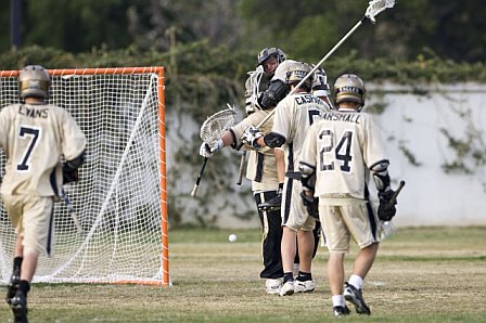 Defense congratulates goalie Max Luchs in upset win over Mira Costa