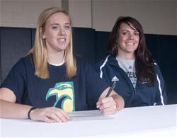 Seated beside BCC womenâ€™s basketball coach Ashlyn Burke, Chelsea McGowan signed a letter of intent Nov. 10 to play basketball for UNC Wilmington.