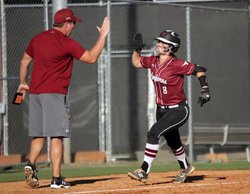 Lambert's Rachel Cowart is congratulated by head coach Brooks Youngblood after hitting a home run against Mill Creek.