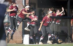 Lambert softball players celebrate after a big play against Mill Creek on Thursday, Oct. 12, 2017.